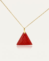 Amitabha Triangle cinnabar necklace on gold chain, ivory studio background