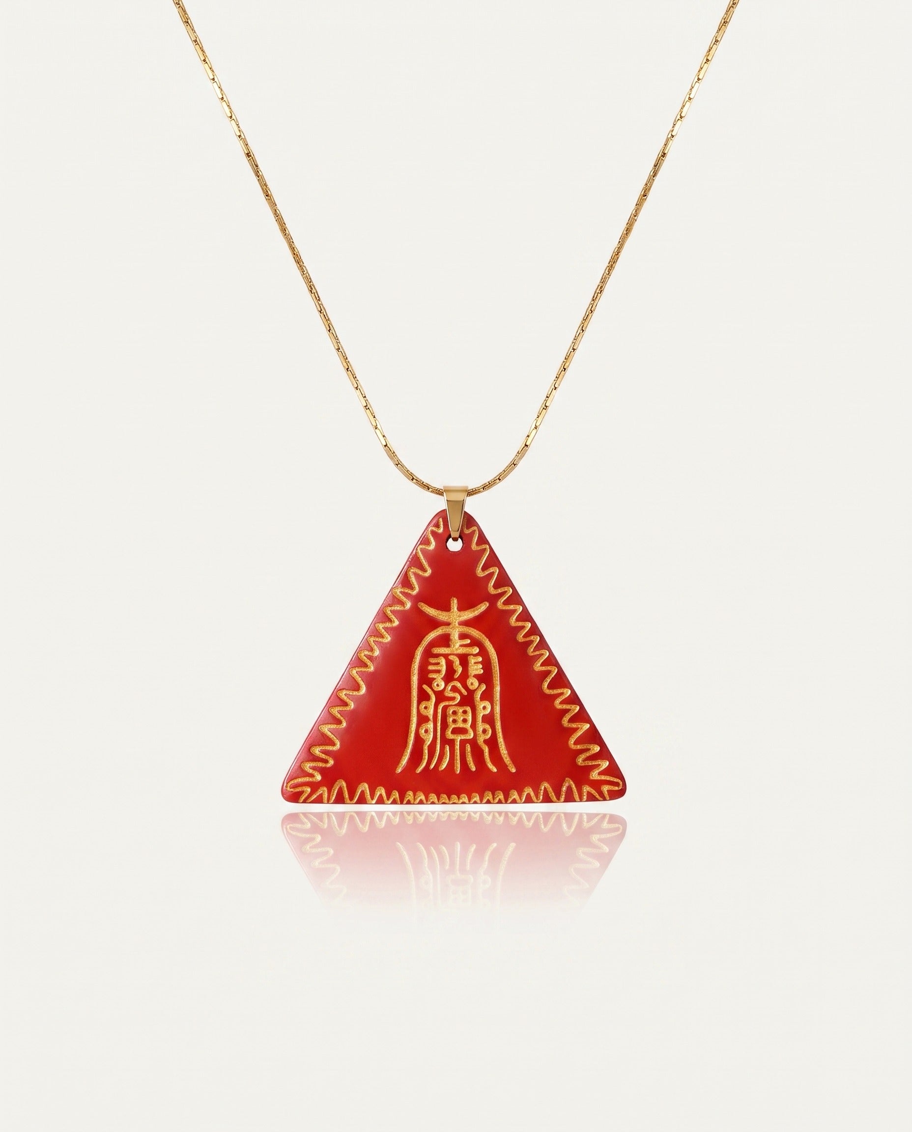 Amitabha Triangle cinnabar necklace on ivory studio background