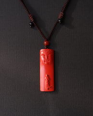 Buddha Pillar cinnabar necklace on dark background