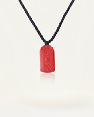 Dragon Yin Yang Talisman cinnabar necklace on ivory studio background