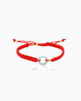 red-string-jade-peace-donut-pendant-bracelet