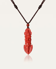 Guan Yin Phurba cinnabar necklace on ivory studio background