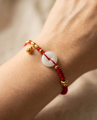 Jade with Hulu Health Charm Red String Bracelet worn on wrist