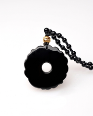 Coiled Pixiu obsidian pendant scalloped back