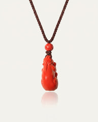 Pixiu cinnabar necklace on ivory studio background