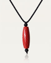 Six Character Mantra Cylinder cinnabar necklace on ivory studio background