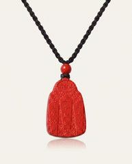 Wealth God cinnabar necklace on ivory studio background
