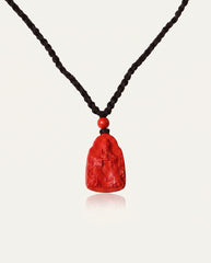 Wealth God cinnabar necklace front on ivory studio background