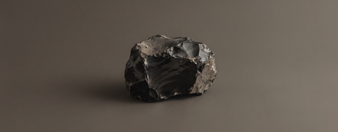 Obsidian collection — raw obsidian on warm charcoal