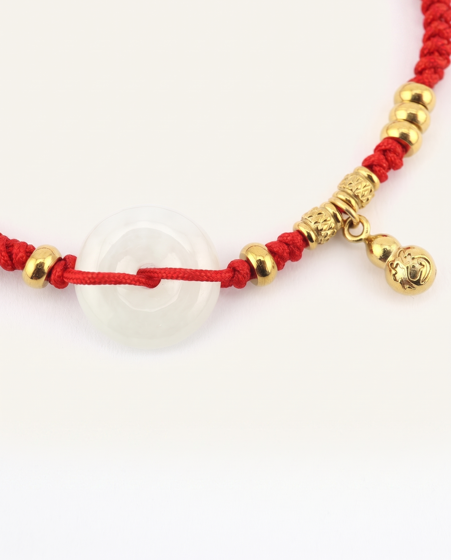 Jade with Hulu Health Charm Red String Bracelet, side view