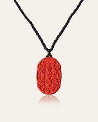 Auspicious Talisman cinnabar necklace on ivory studio background
