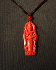 Guan Yin cinnabar necklace on dark background