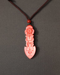 Guan Yin Phurba cinnabar necklace on dark background