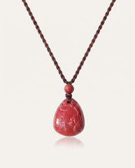 Heart Sutra Teardrop cinnabar necklace on ivory studio background