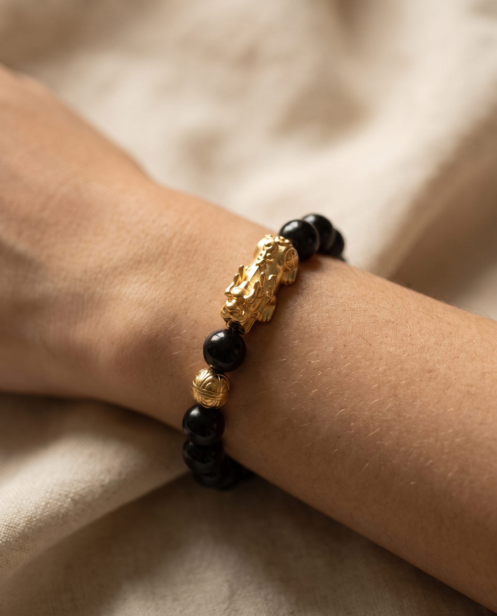 Wealth Charm Pixiu Dragon Obsidian Bracelet worn on wrist