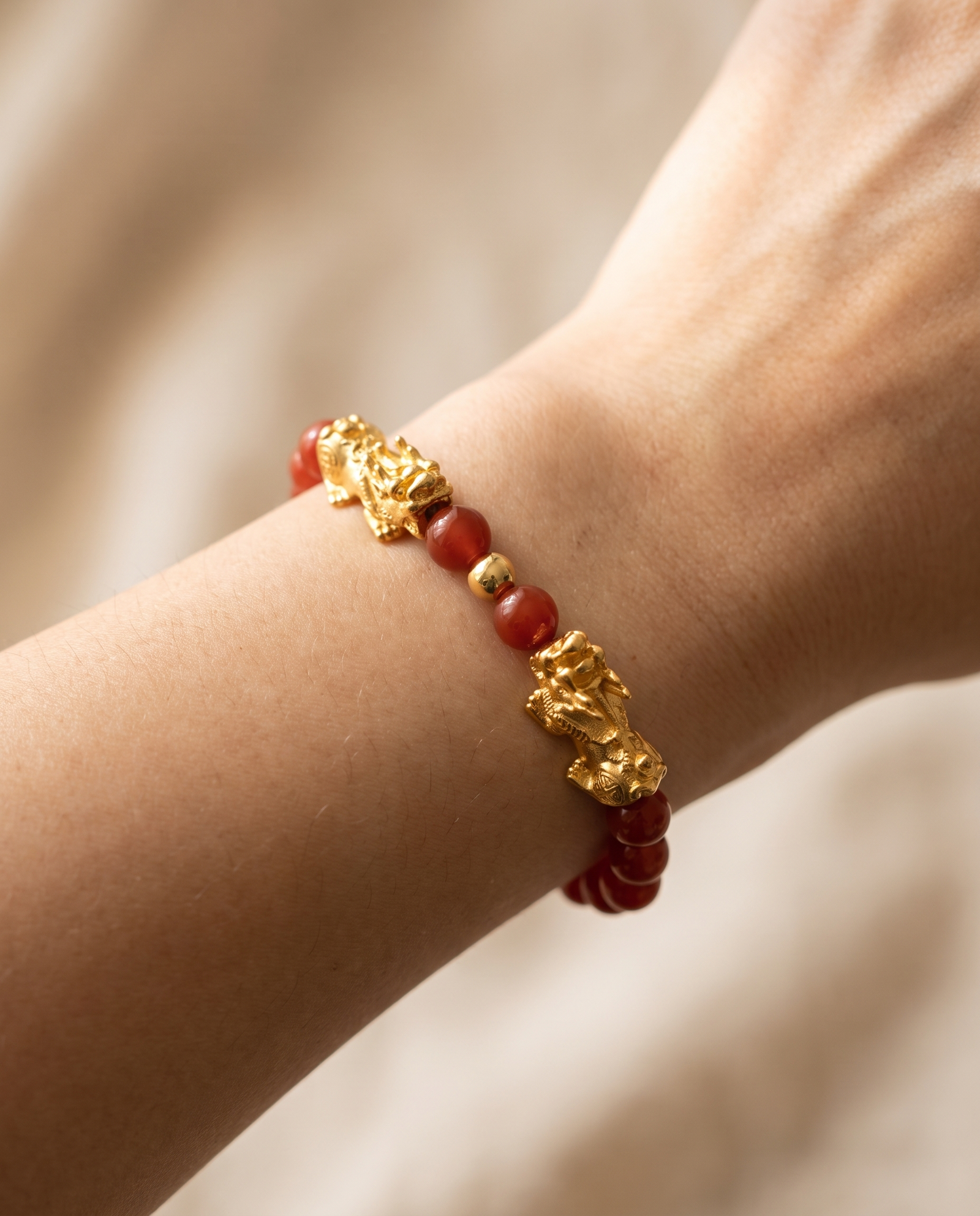 Fortune Charm Mini Pixiu Dragon Red Agate Bracelet worn on wrist