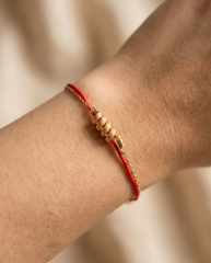 Snake Zodiac Red String Bracelet worn on wrist