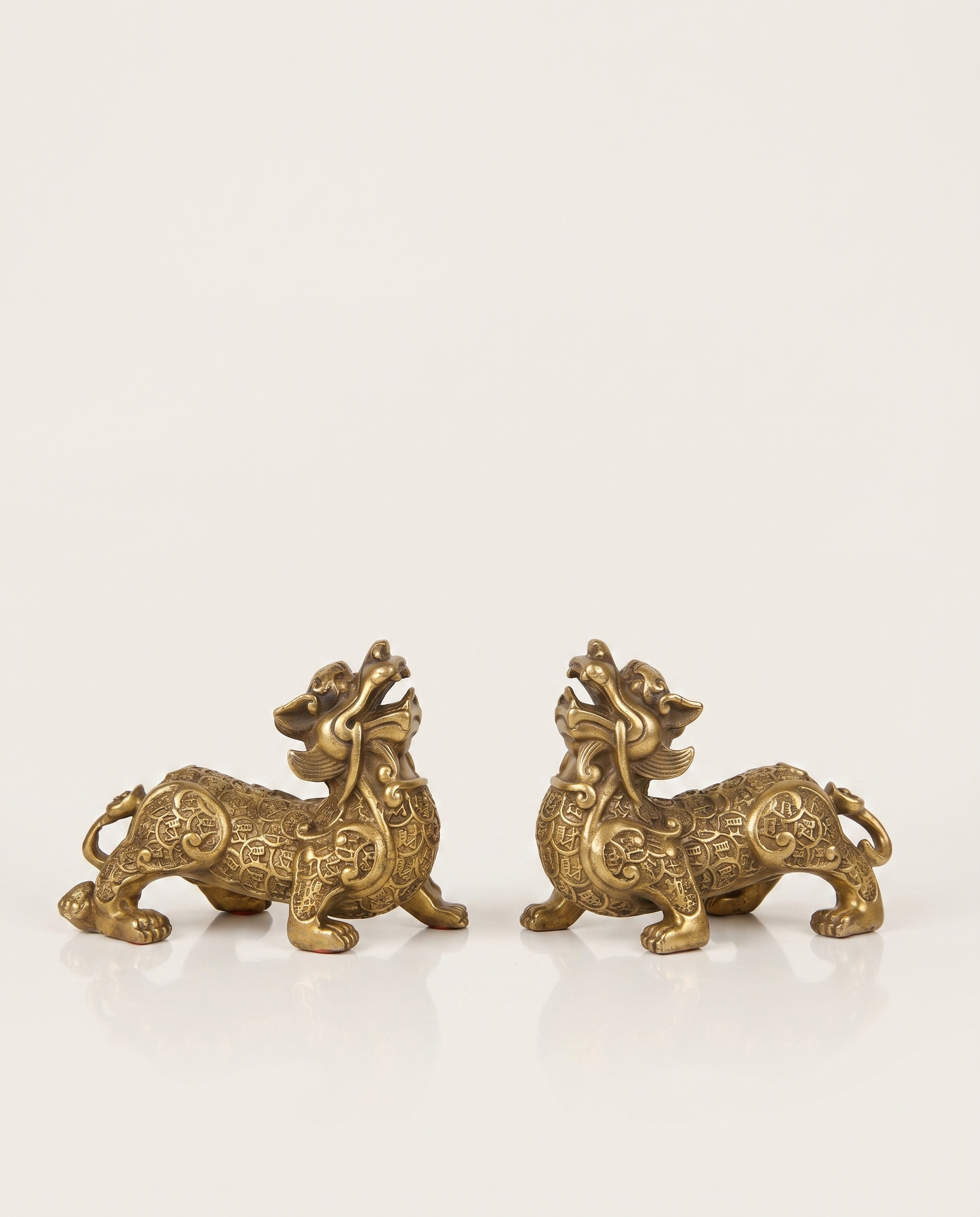 brass pixiu covered in coins pair