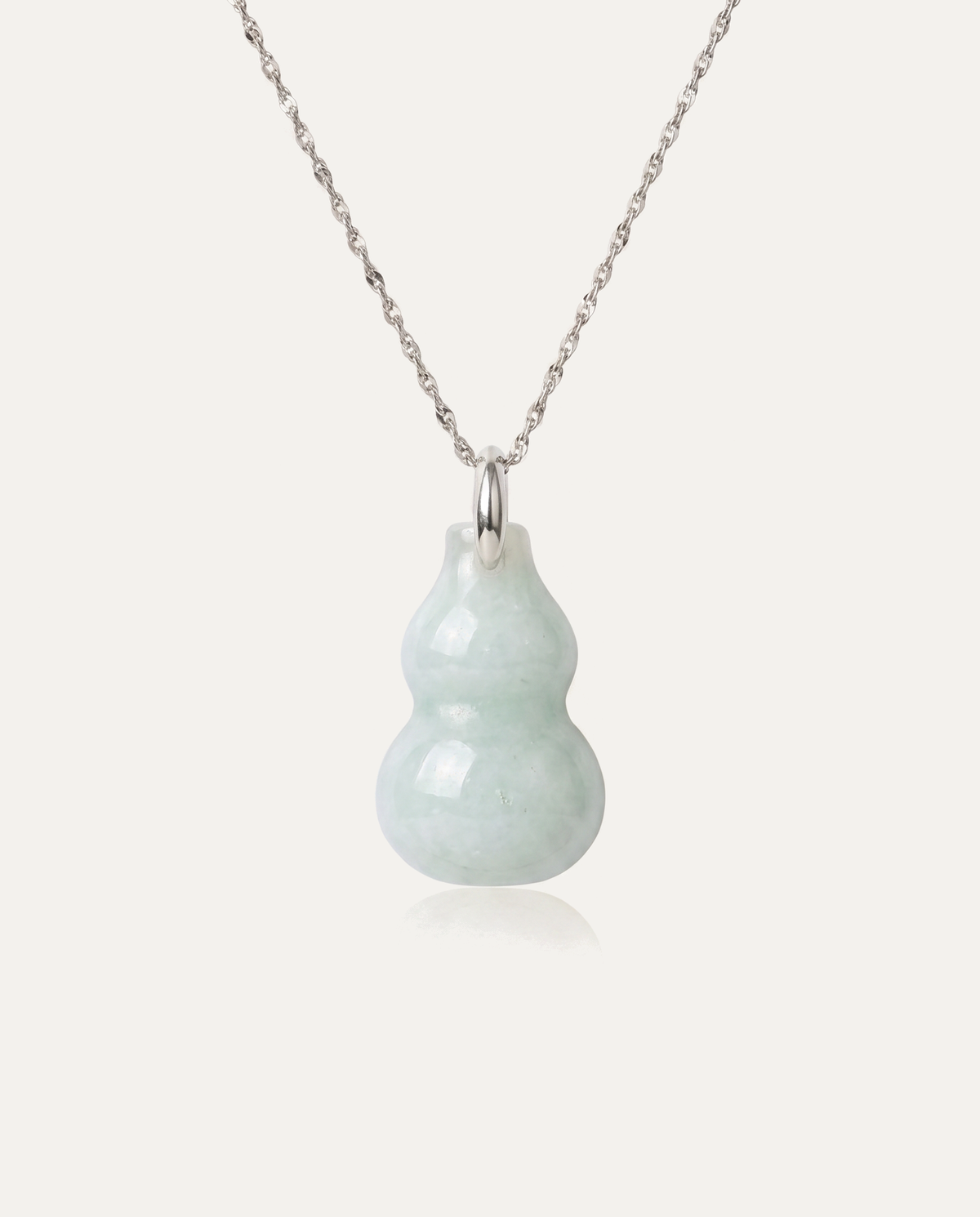 Jade Hulu Gourd Necklace with silver chain on ivory background