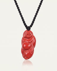 Laughing Buddha cinnabar necklace on ivory studio background