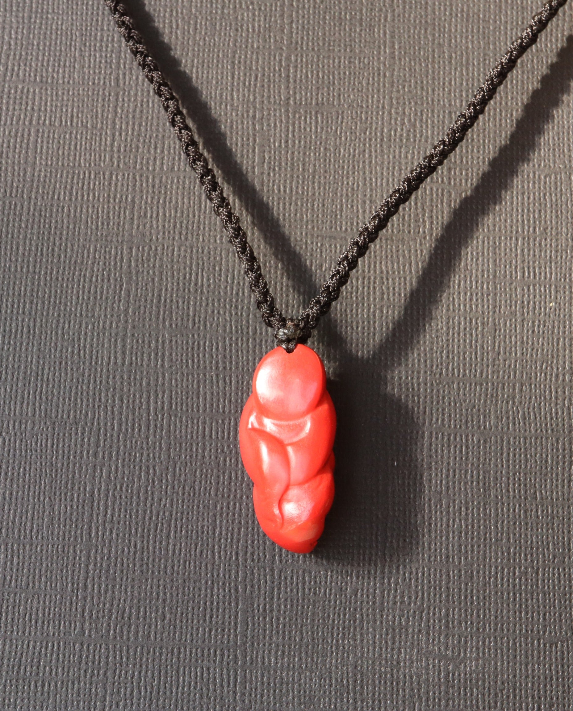 Laughing Buddha cinnabar necklace worn