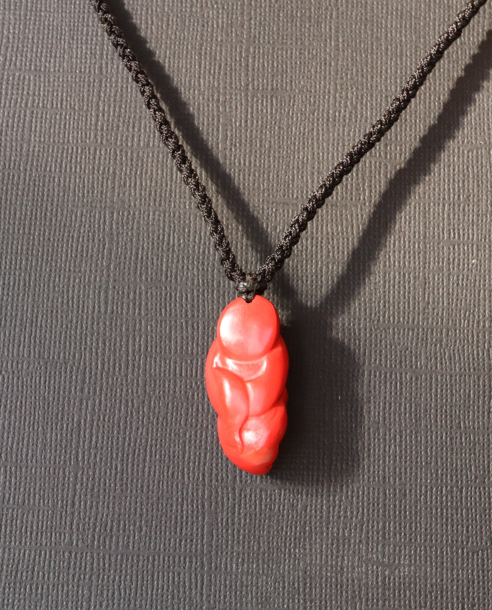 Laughing Buddha cinnabar necklace worn
