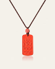 Mantra Protection Amulet cinnabar necklace on ivory studio background