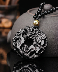 Coiled Pixiu obsidian pendant on beaded cord