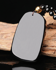 Guan Kong obsidian pendant smooth back