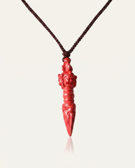 Phurba cinnabar necklace on ivory studio background