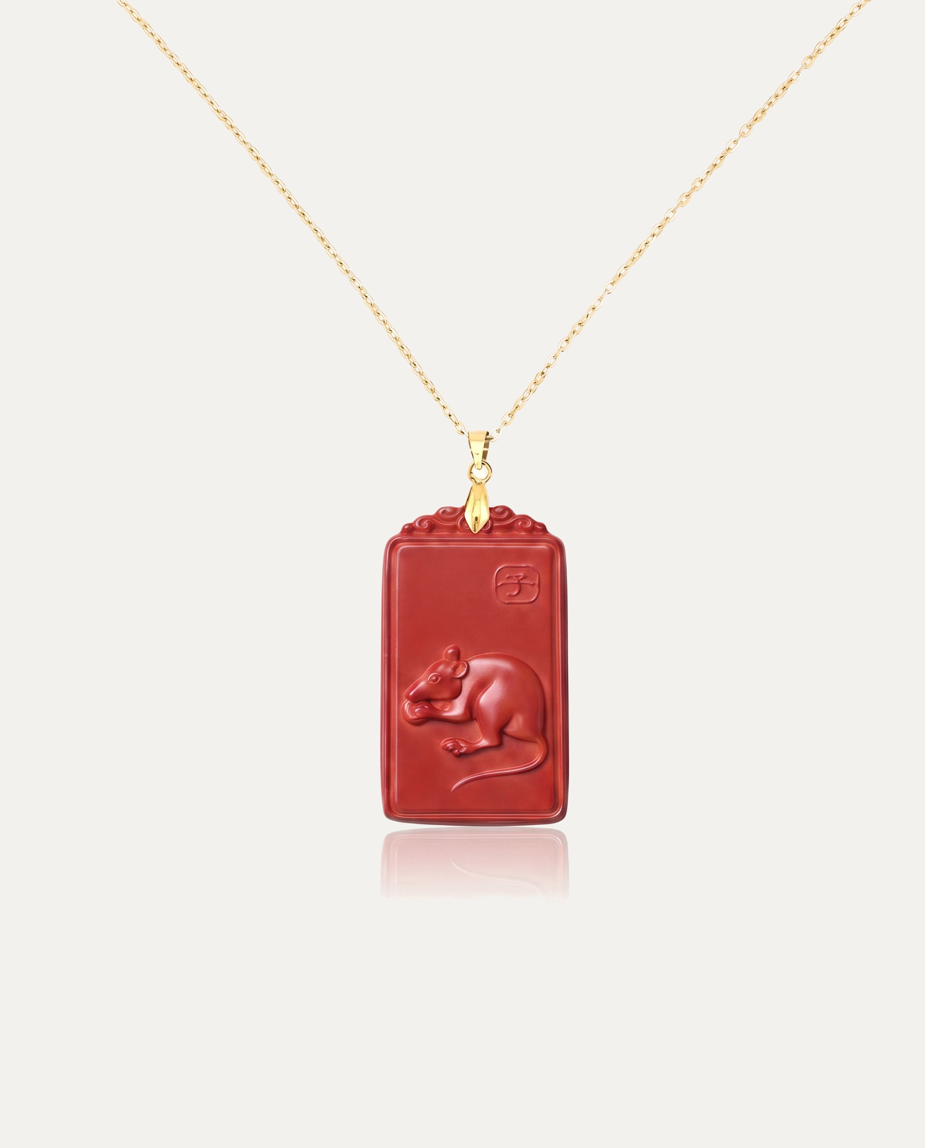 Rat zodiac cinnabar pendant necklace gold chain on ivory background