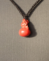 Smooth Hulu cinnabar necklace worn
