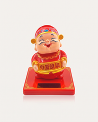 Solar Nodding God of Wealth with wealth scroll on red base