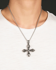 Model wearing the double vajra cross necklace
