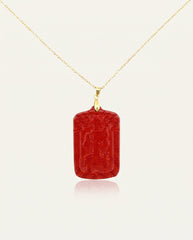 Wealth Talisman cinnabar necklace on gold chain front, ivory studio background