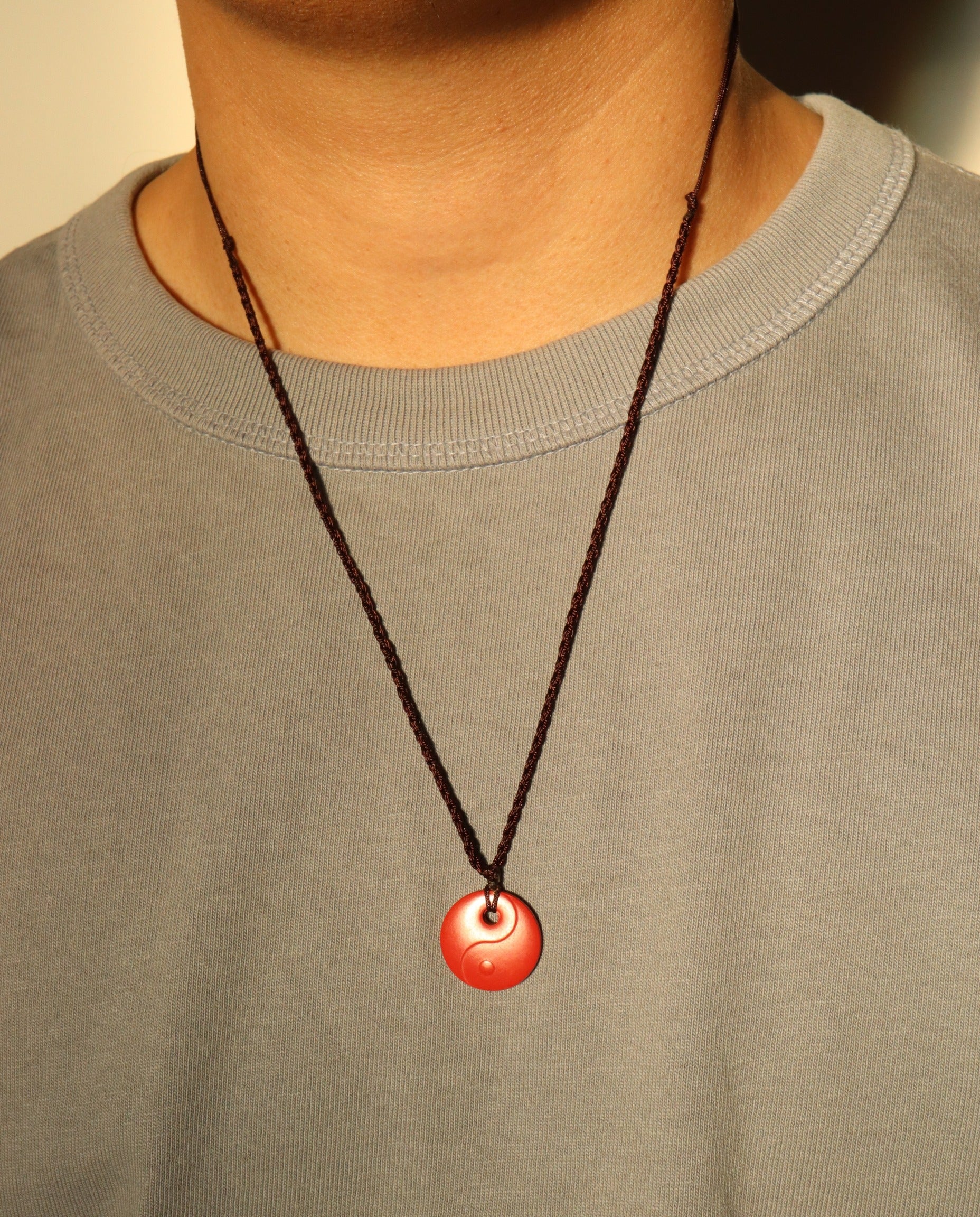 Yin Yang cinnabar necklace worn